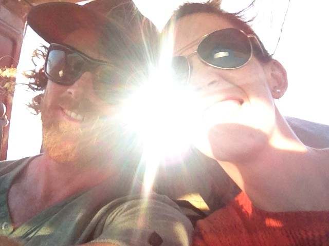 Couple smiling in the sunlight